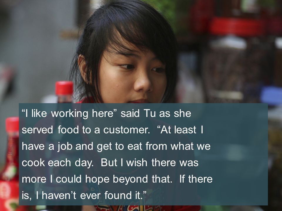 I like working here said Tu as she served food to a customer.