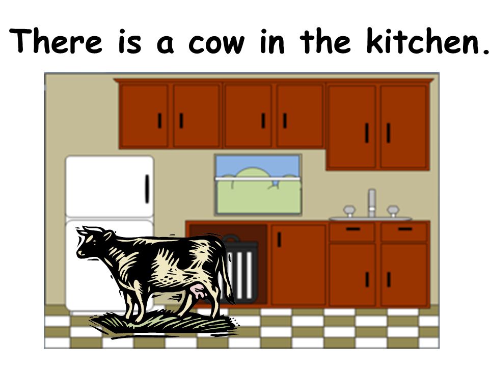 There is a cow in the kitchen.