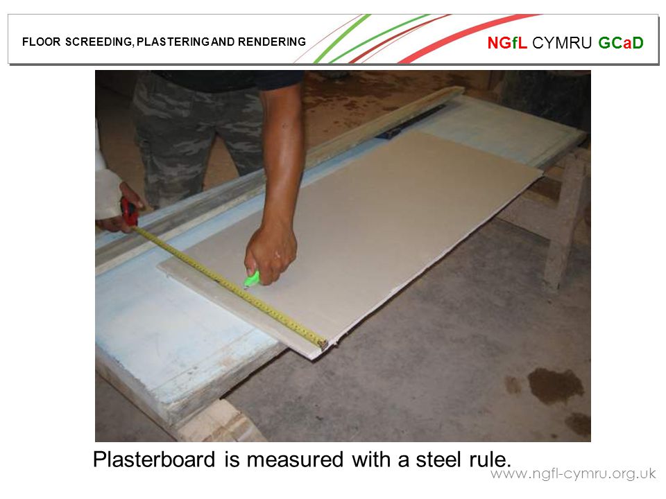 NGfL CYMRU GCaD   Plasterboard is measured with a steel rule.