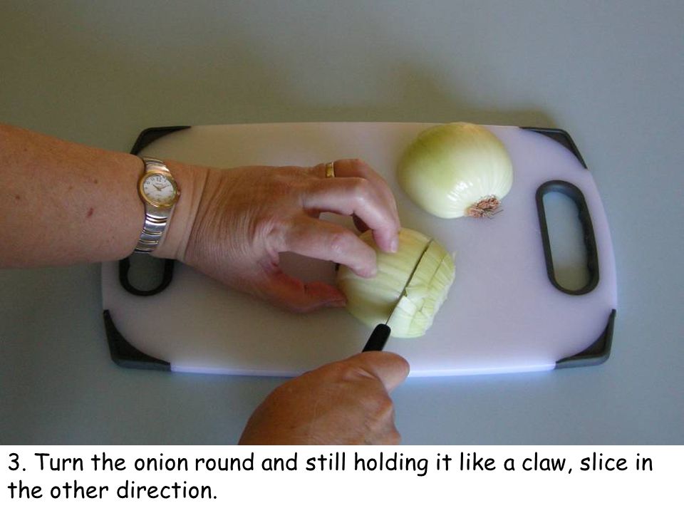 3. Turn the onion round and still holding it like a claw, slice in the other direction.
