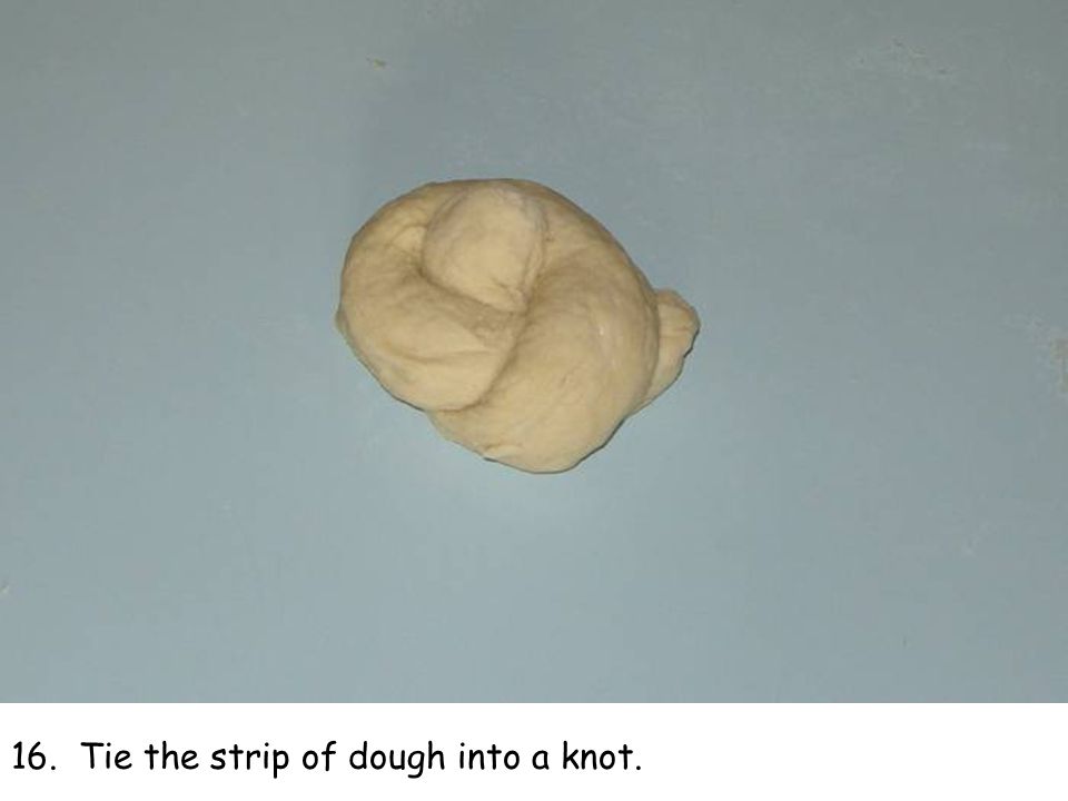 16. Tie the strip of dough into a knot.