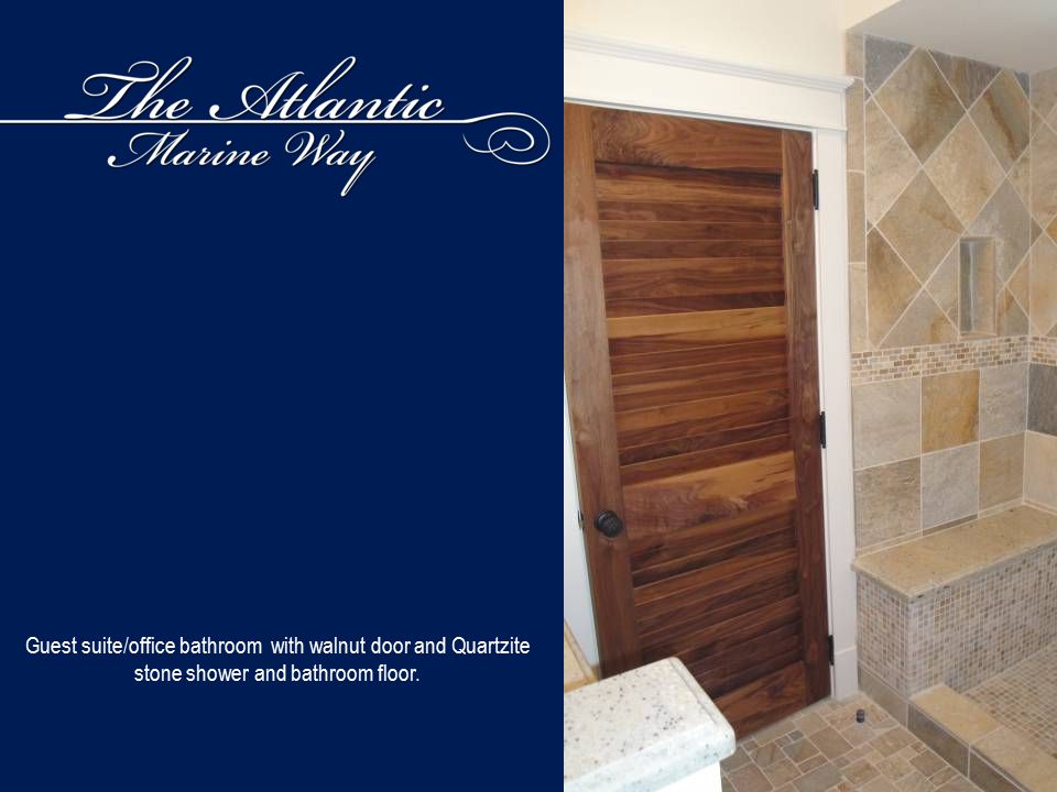 Guest suite/office bathroom with walnut door and Quartzite stone shower and bathroom floor.