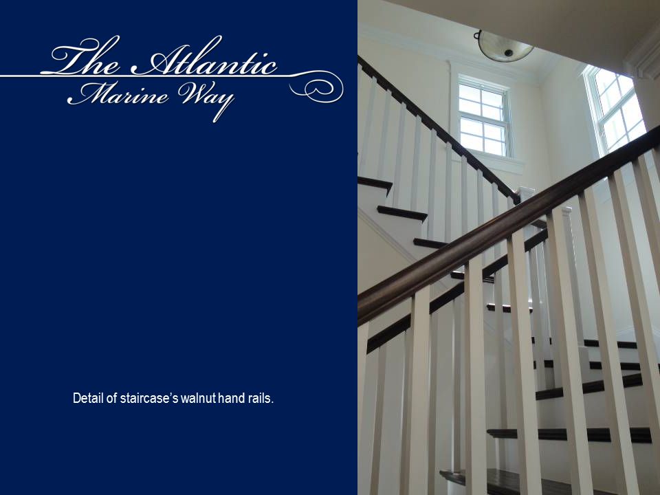 Detail of staircase’s walnut hand rails.