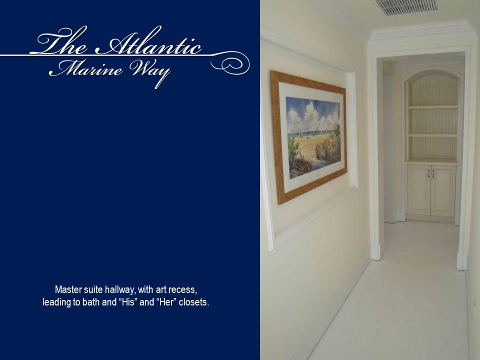 Master suite hallway, with art recess, leading to bath and His and Her closets.