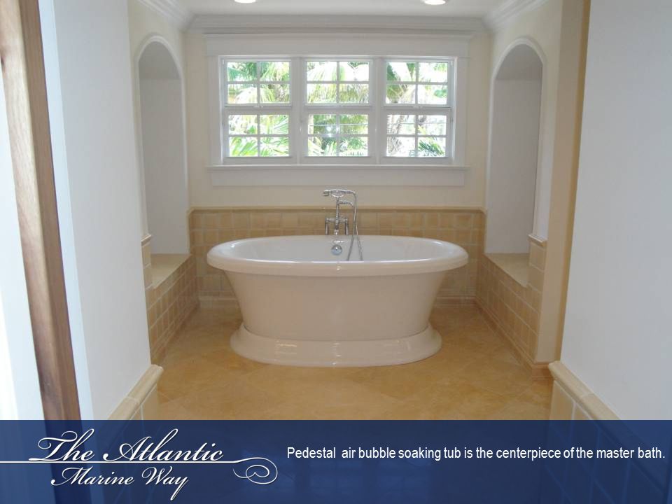 Pedestal air bubble soaking tub is the centerpiece of the master bath.