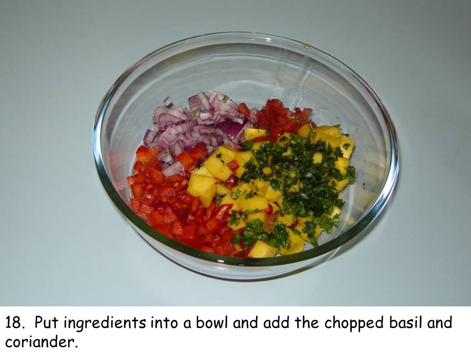 18. Put ingredients into a bowl and add the chopped basil and coriander.