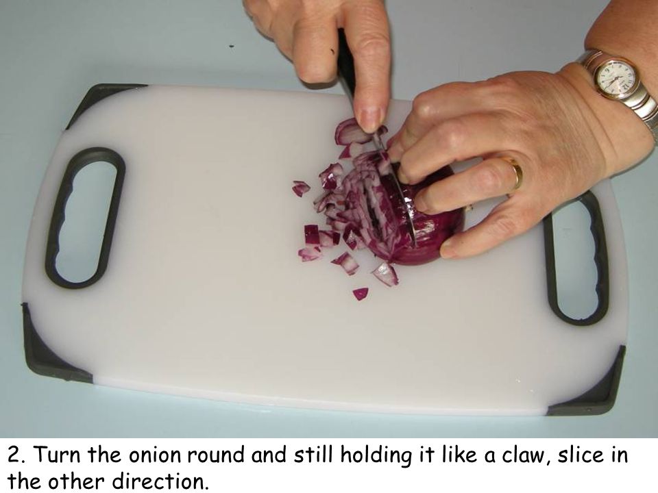 2. Turn the onion round and still holding it like a claw, slice in the other direction.