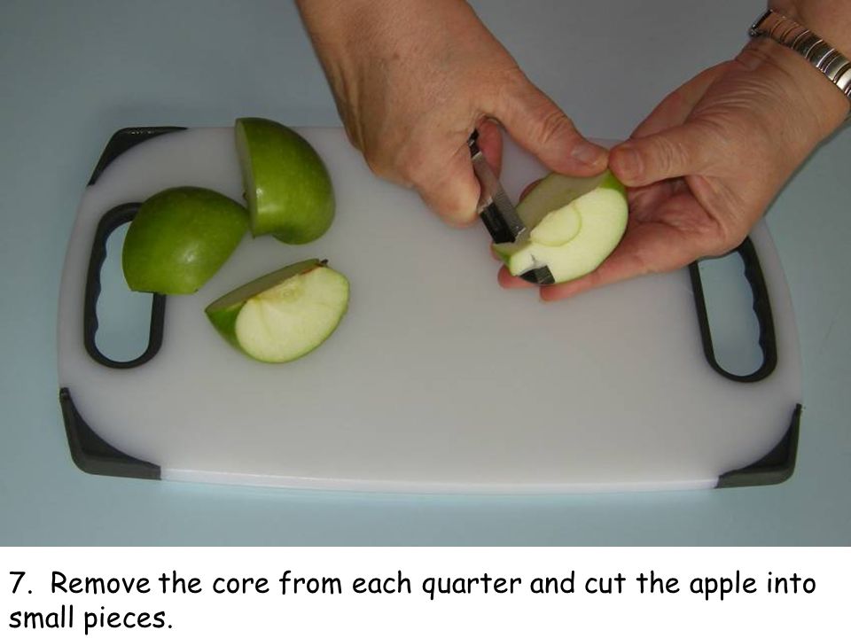 7. Remove the core from each quarter and cut the apple into small pieces.