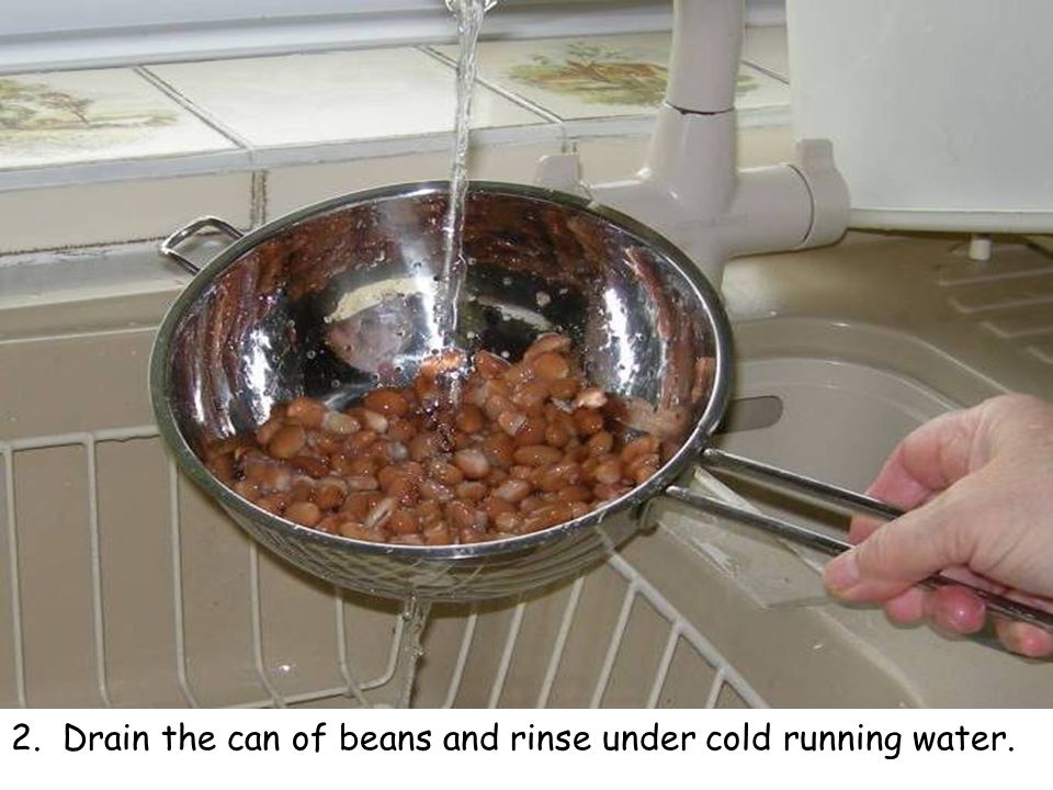 2. Drain the can of beans and rinse under cold running water.