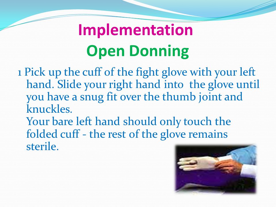 Implementation Open Donning 1 Pick up the cuff of the fight glove with your left hand.