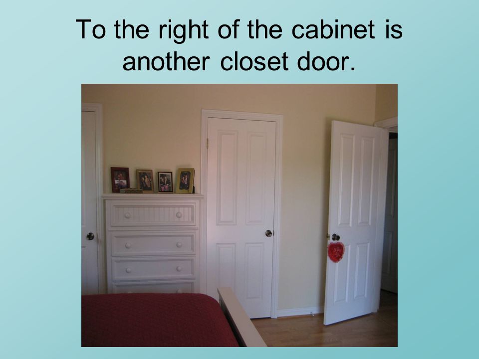 To the right of the cabinet is another closet door.