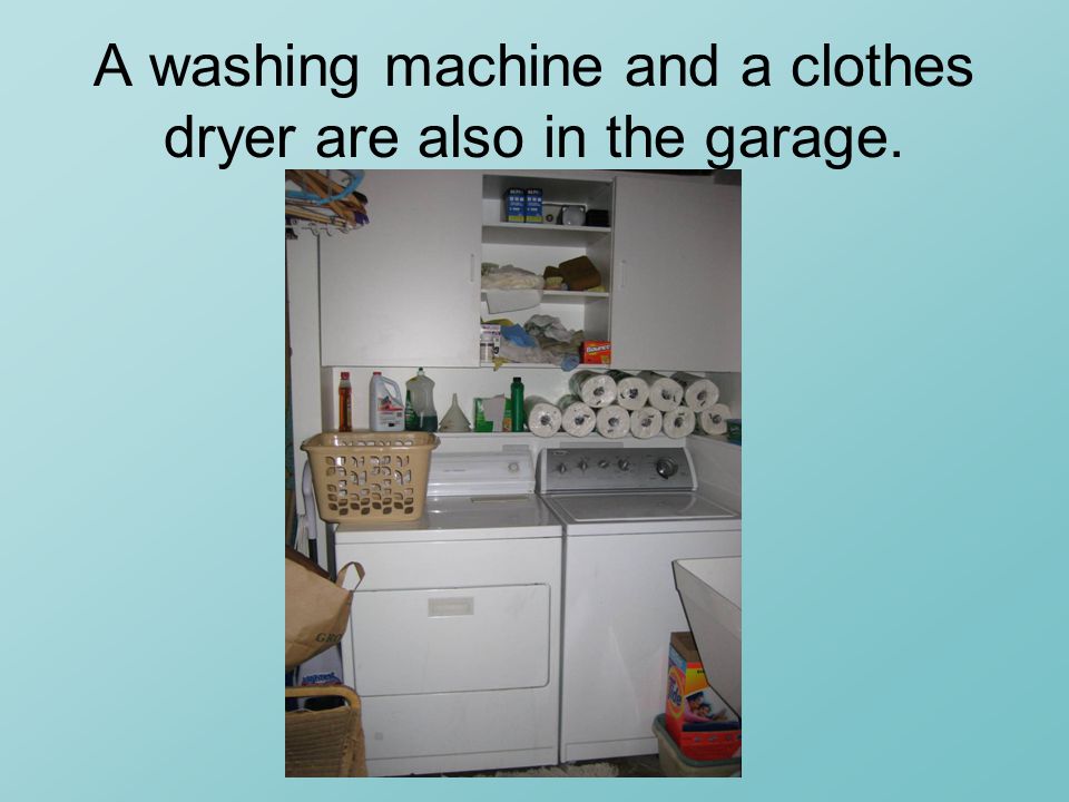A washing machine and a clothes dryer are also in the garage.