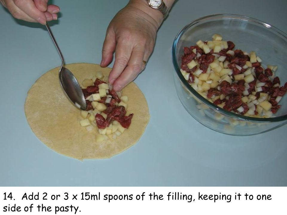 14. Add 2 or 3 x 15ml spoons of the filling, keeping it to one side of the pasty.
