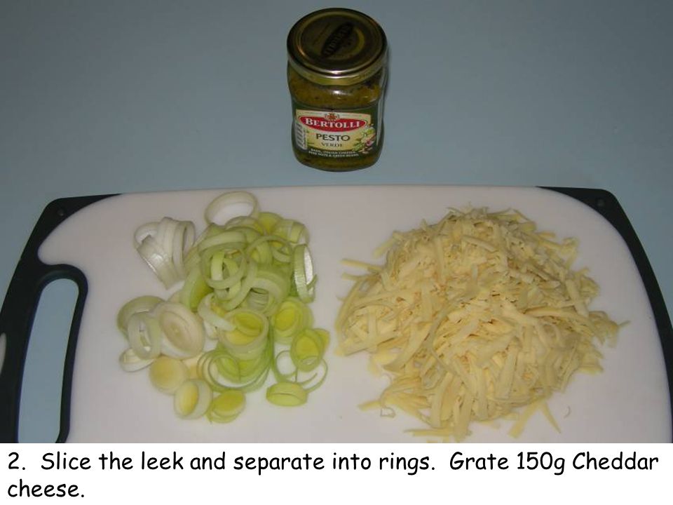 2. Slice the leek and separate into rings. Grate 150g Cheddar cheese.