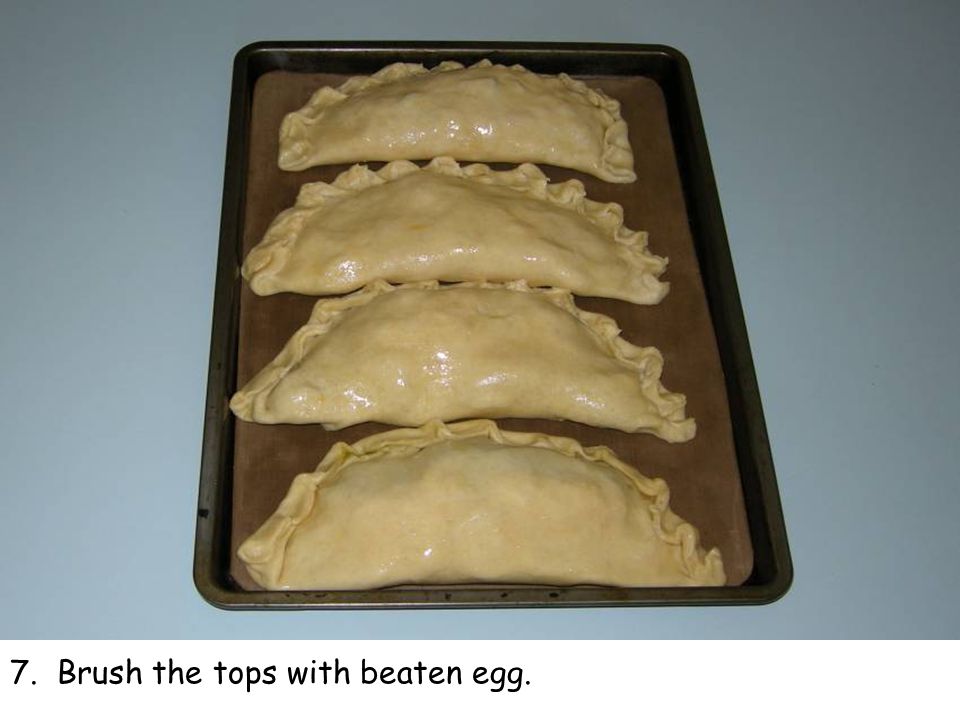 7. Brush the tops with beaten egg.