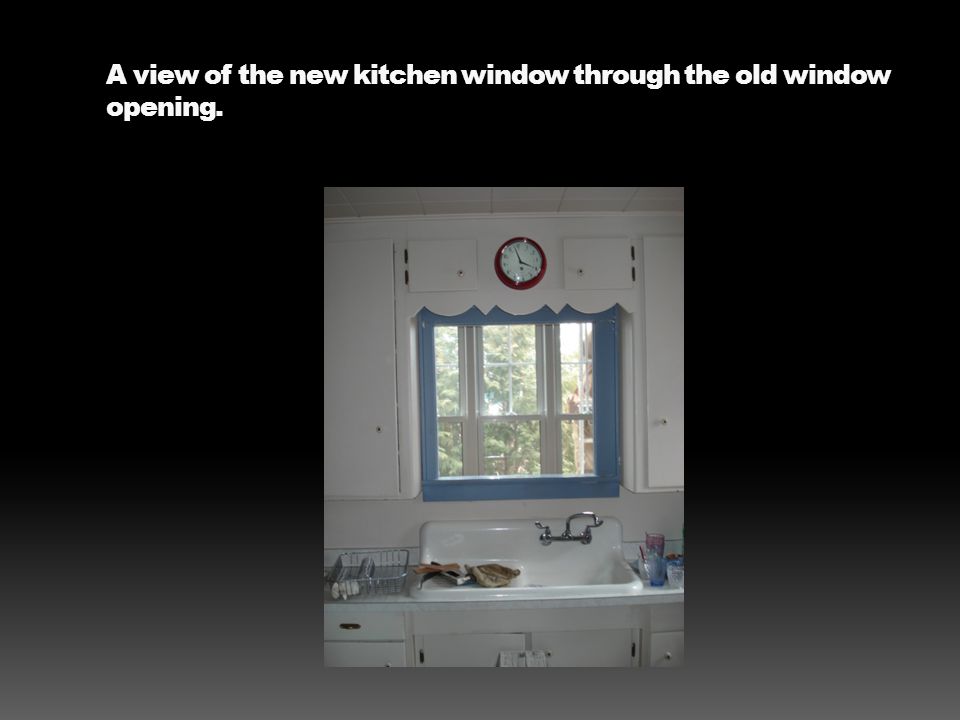 A view of the new kitchen window through the old window opening.