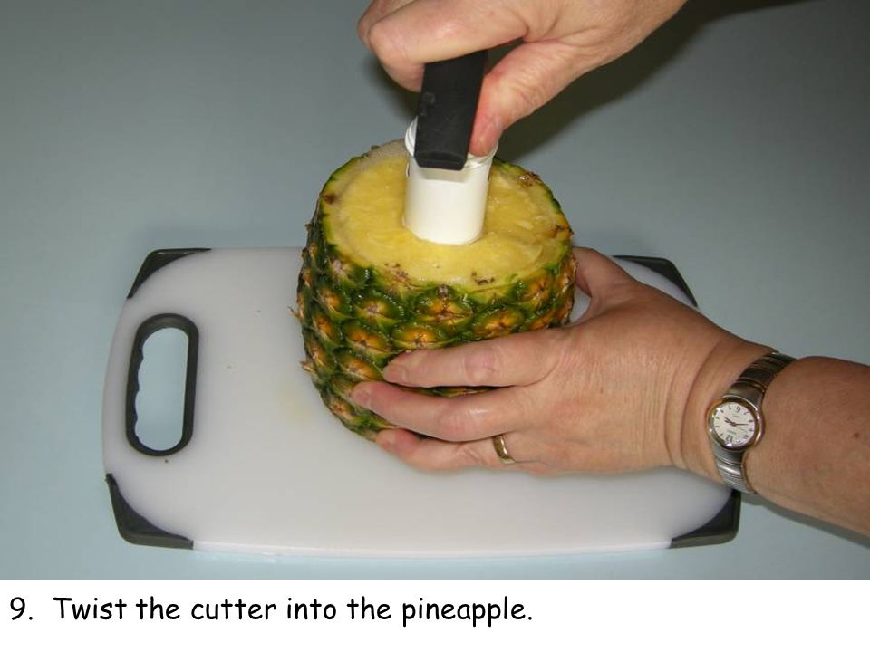 9. Twist the cutter into the pineapple.