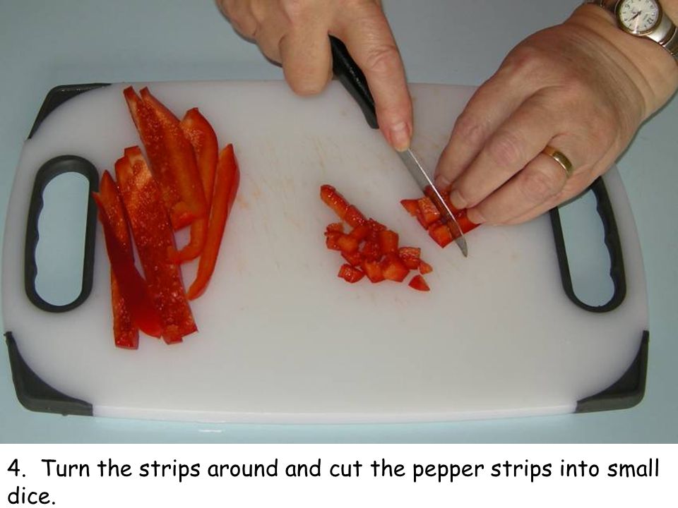 4. Turn the strips around and cut the pepper strips into small dice.