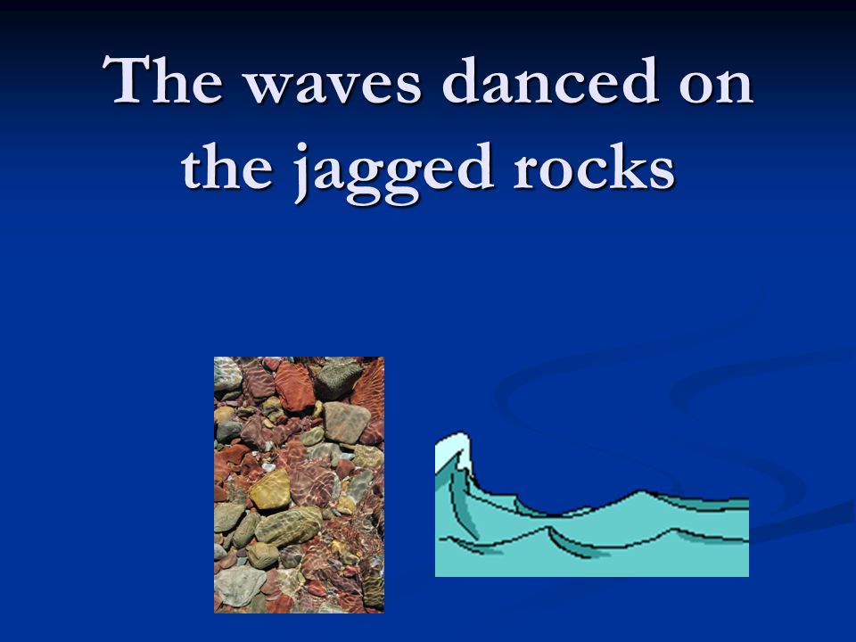The waves danced on the jagged rocks