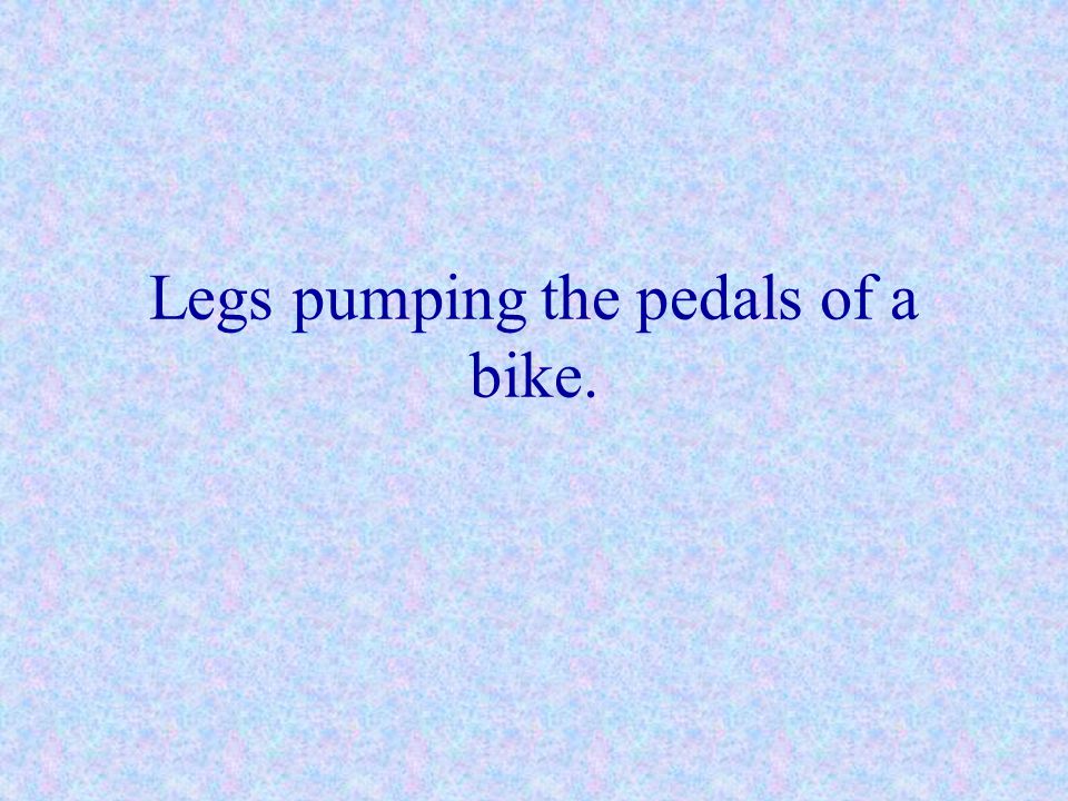 Legs pumping the pedals of a bike.