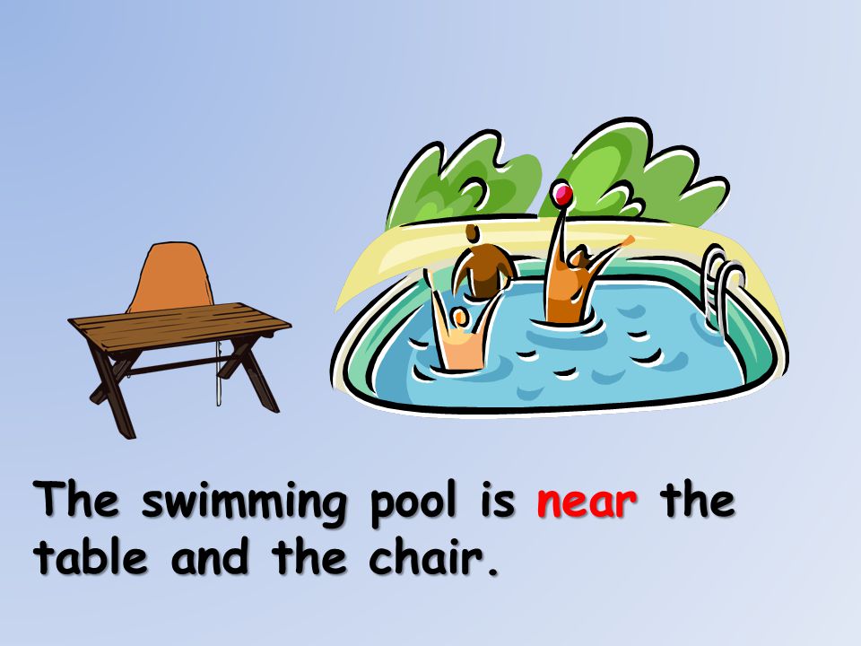 The swimming pool is near the table and the chair.