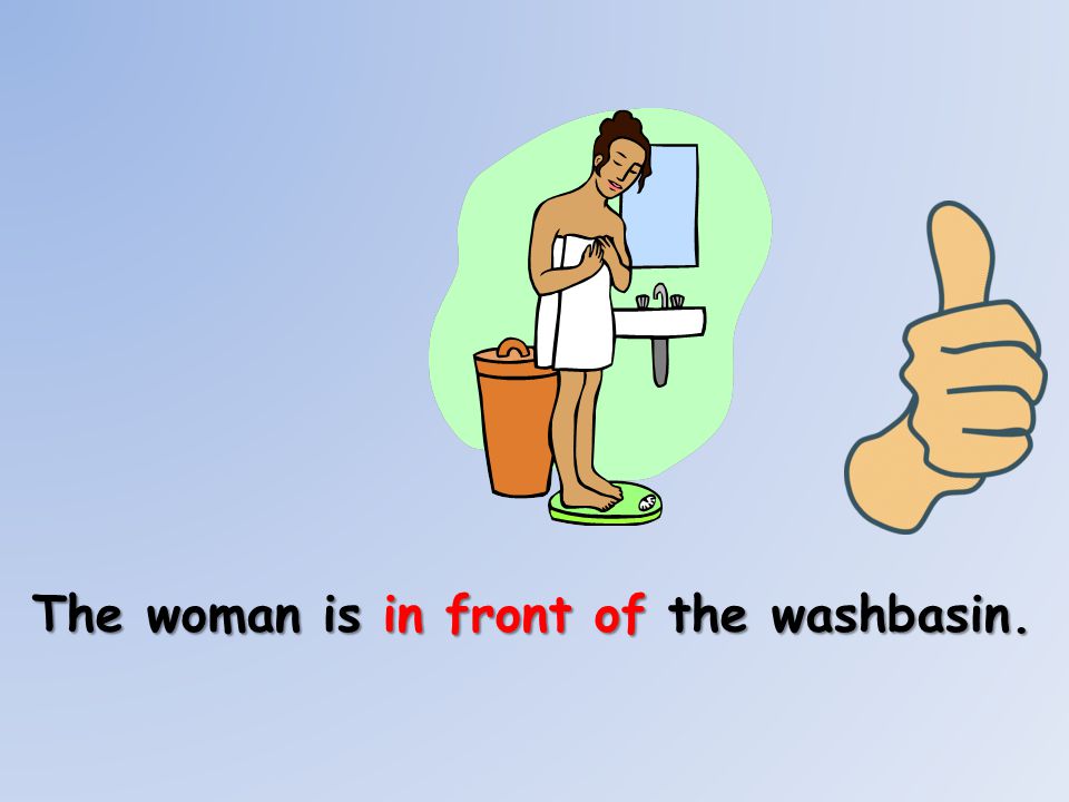The woman is in front of the washbasin.