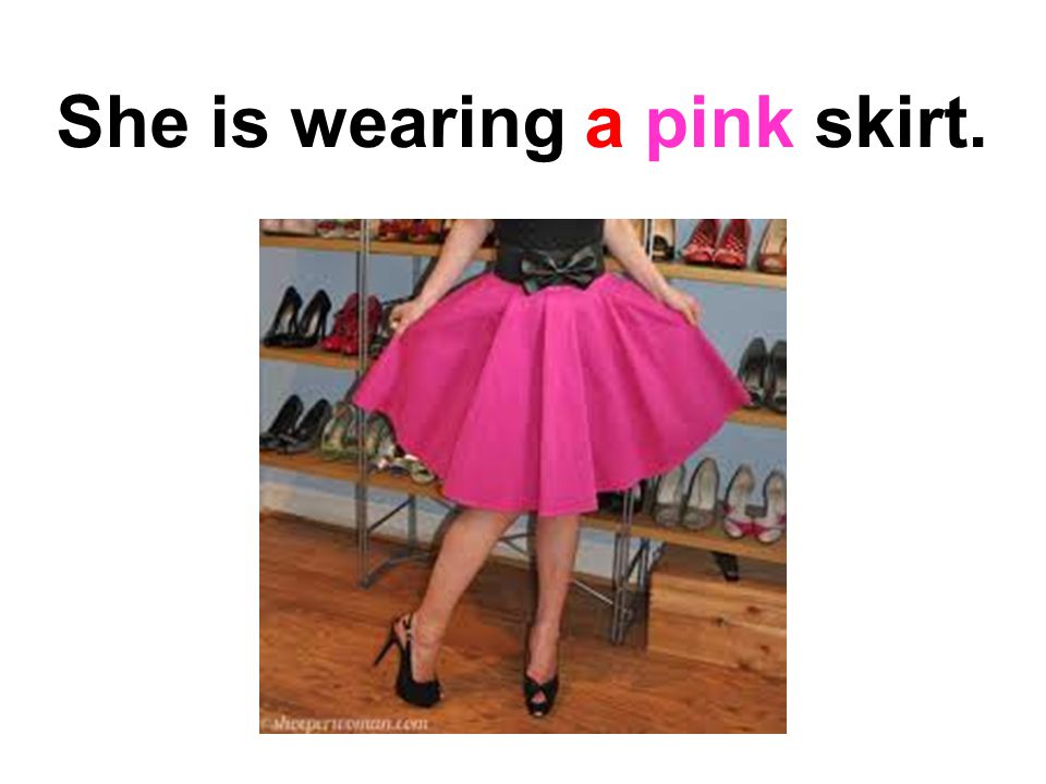 She is wearing a pink skirt.