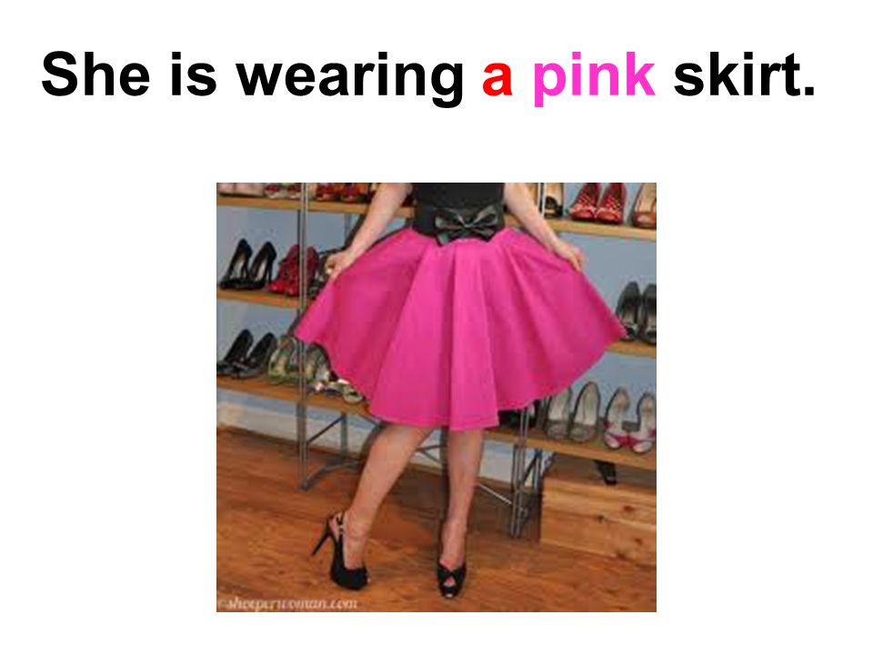 She is wearing a pink skirt.