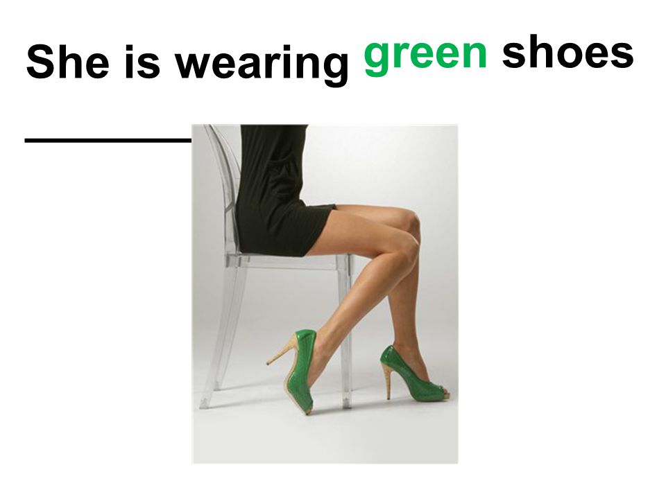 She is wearing ______________. green shoes