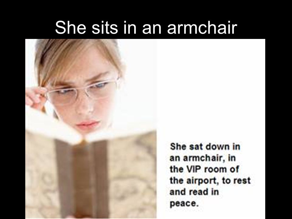 She sits in an armchair