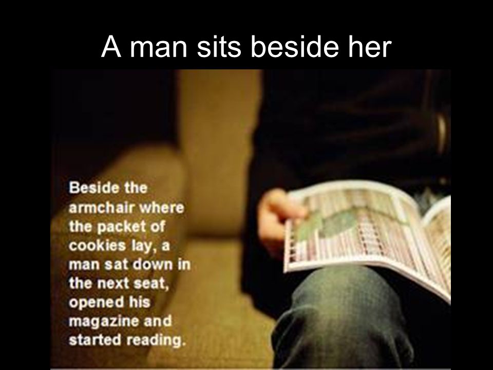 A man sits beside her