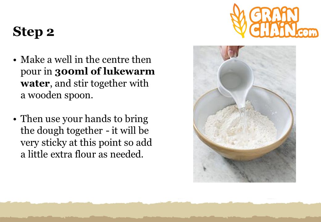 Step 2 Make a well in the centre then pour in 300ml of lukewarm water, and stir together with a wooden spoon.