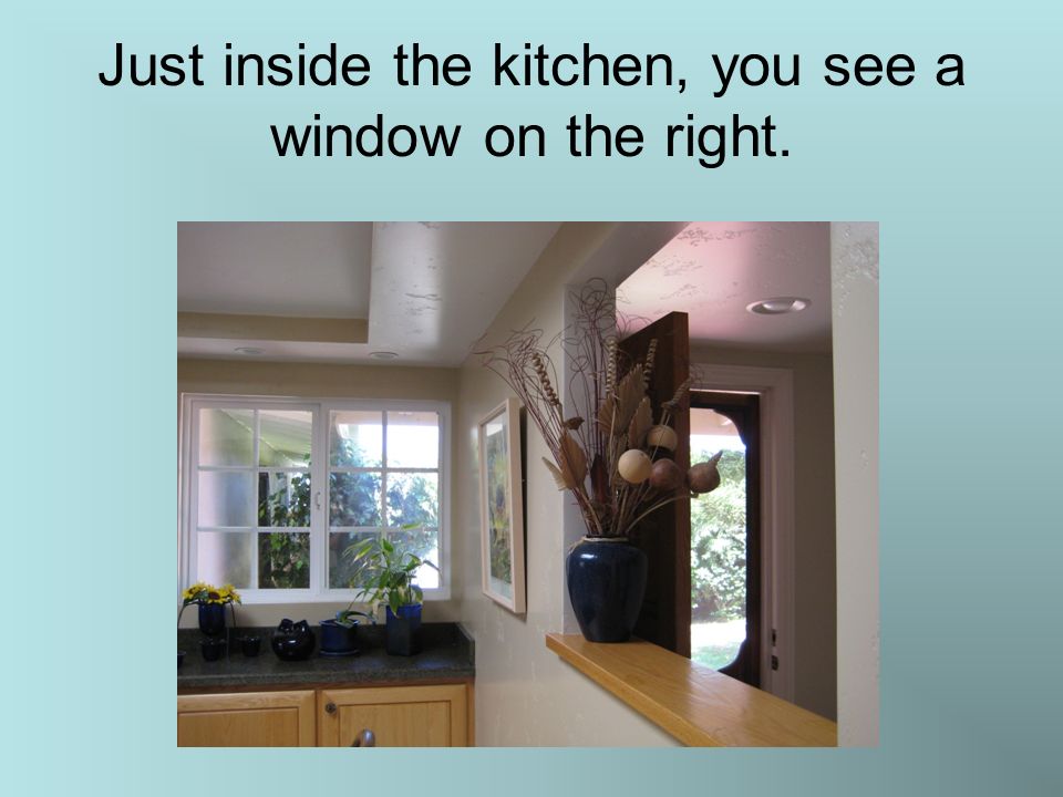Just inside the kitchen, you see a window on the right.