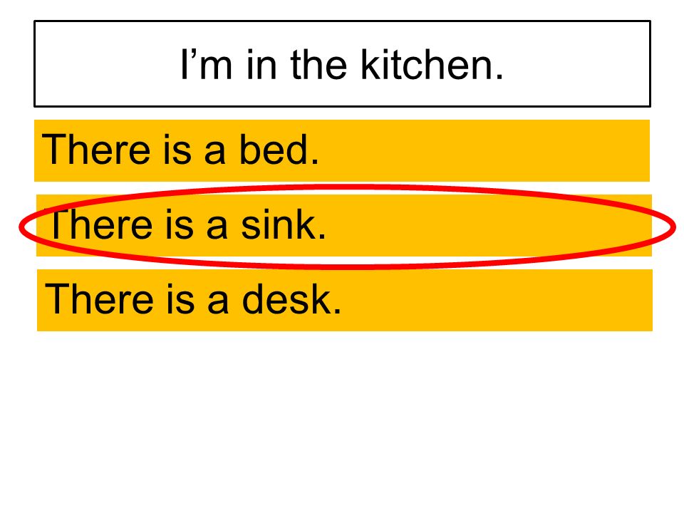 I’m in the kitchen. There is a bed. There is a sink. There is a desk.