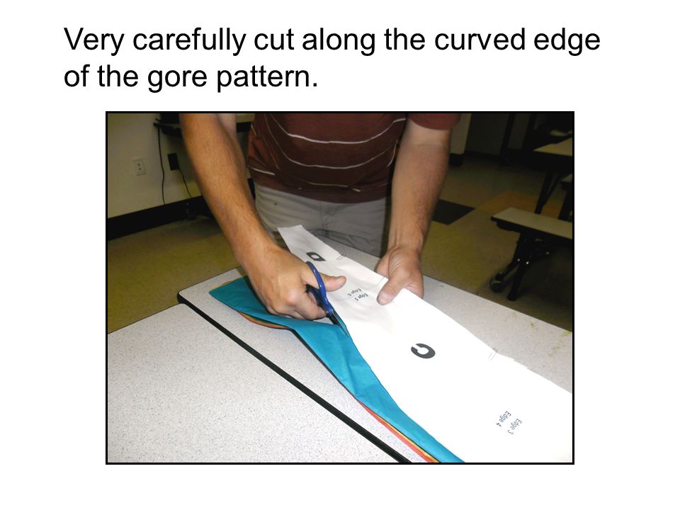 Very carefully cut along the curved edge of the gore pattern.