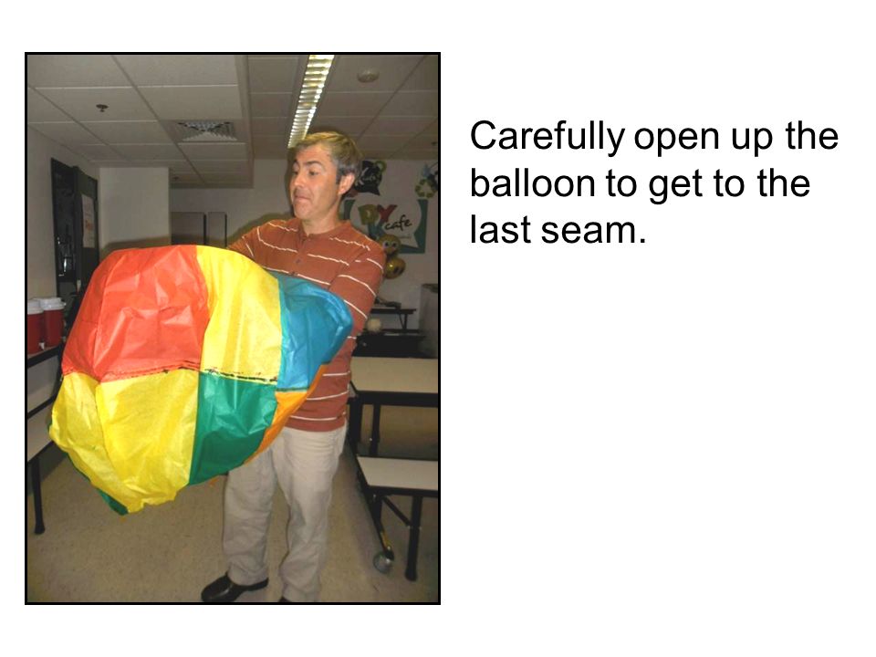 Carefully open up the balloon to get to the last seam.