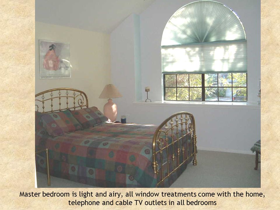 Master bedroom is light and airy, all window treatments come with the home, telephone and cable TV outlets in all bedrooms