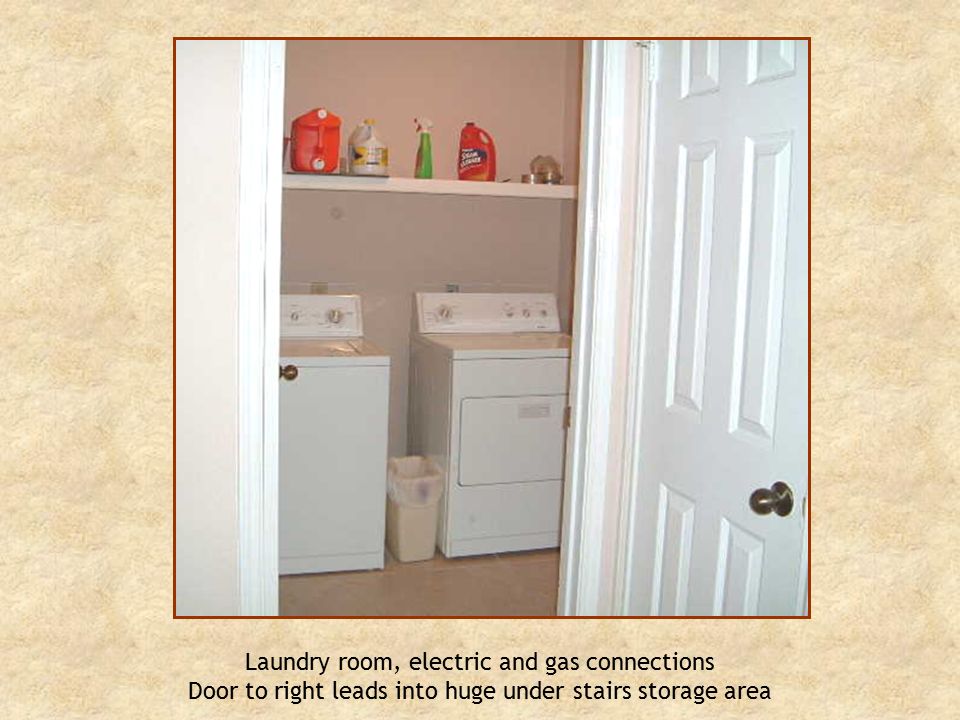 Laundry room, electric and gas connections Door to right leads into huge under stairs storage area