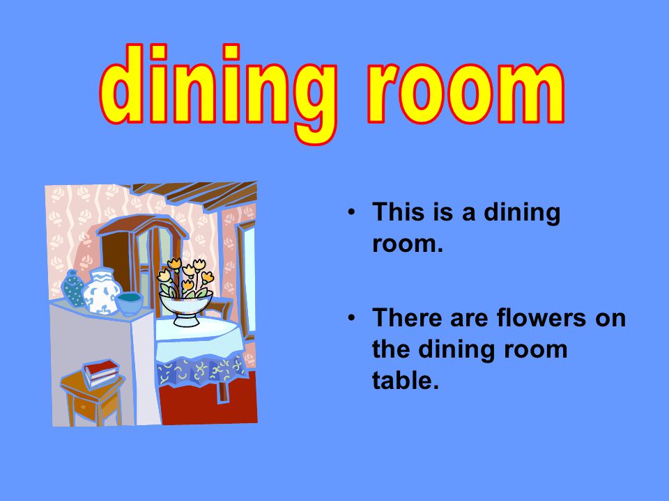 This is a dining room. There are flowers on the dining room table.