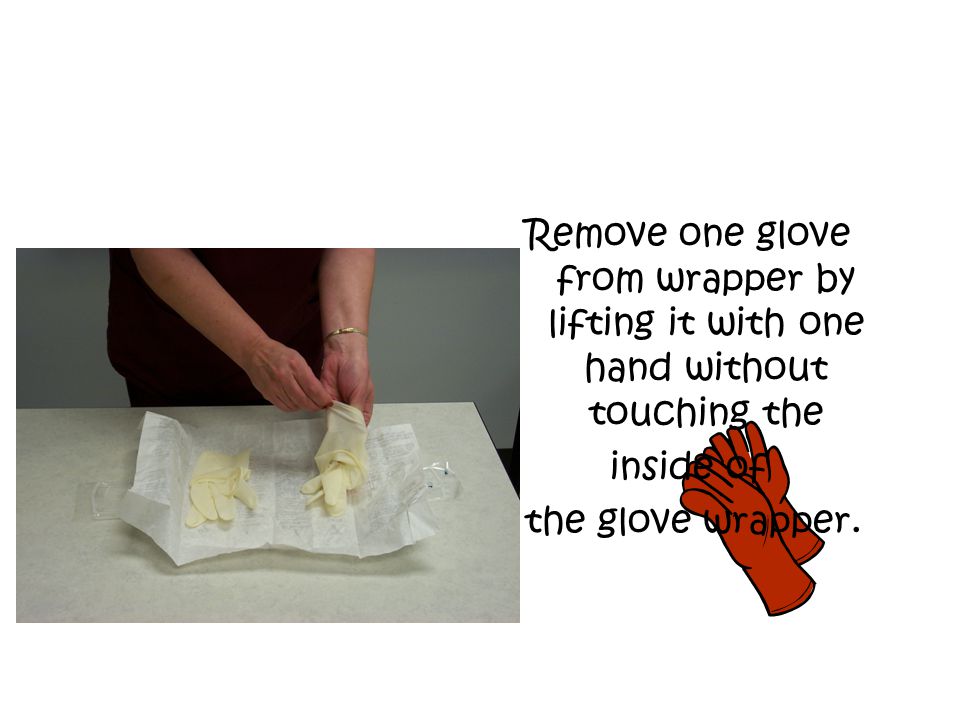 Remove one glove from wrapper by lifting it with one hand without touching the inside of the glove wrapper.