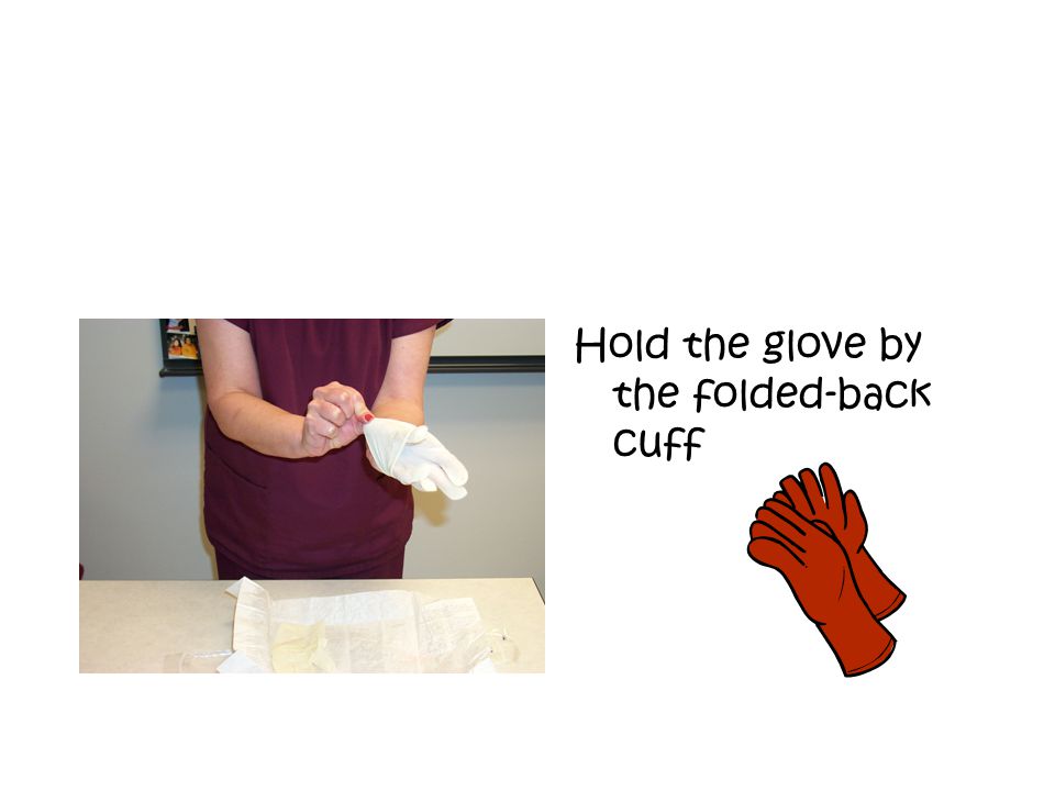 Hold the glove by the folded-back cuff