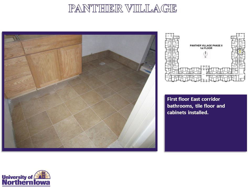 First floor East corridor bathrooms, tile floor and cabinets installed.