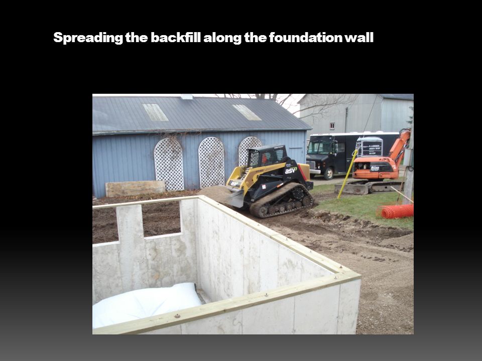 Spreading the backfill along the foundation wall