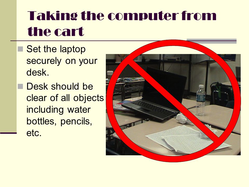 Taking the computer from the cart Set the laptop securely on your desk.