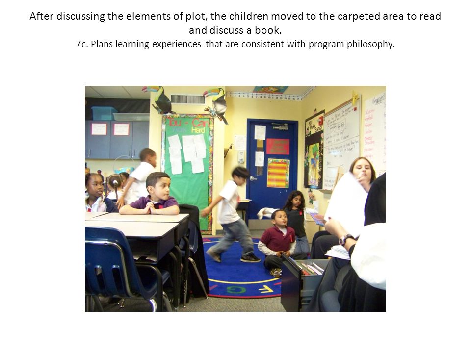 After discussing the elements of plot, the children moved to the carpeted area to read and discuss a book.