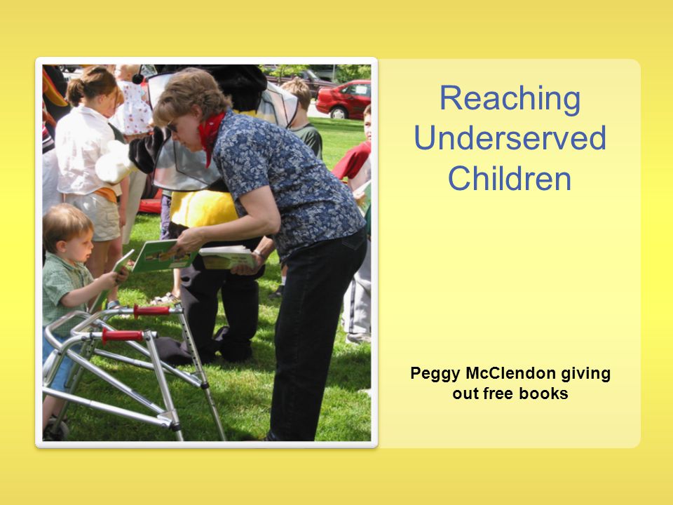 Peggy McClendon giving out free books Reaching Underserved Children