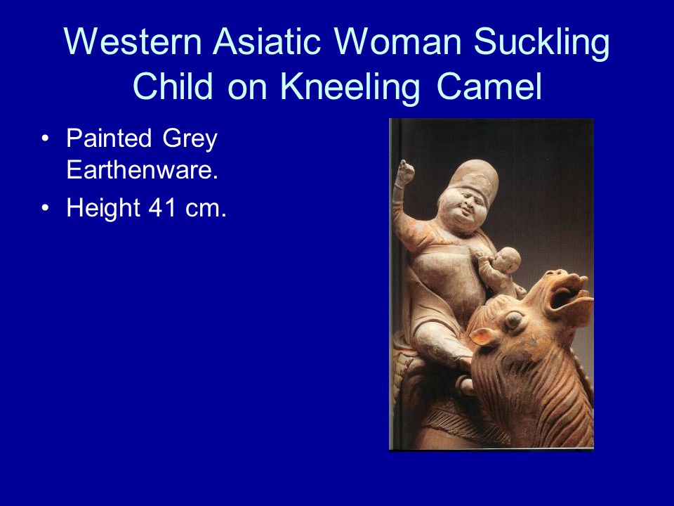 Western Asiatic Woman Suckling Child on Kneeling Camel Painted Grey Earthenware. Height 41 cm.