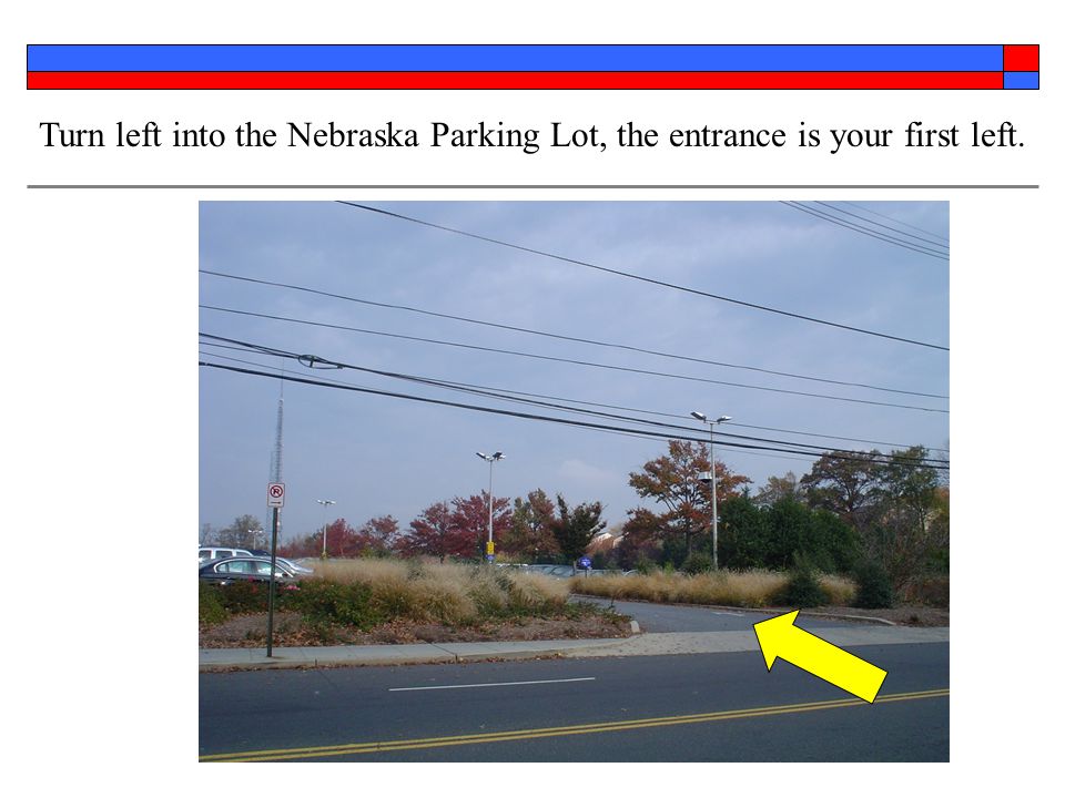 Turn left into the Nebraska Parking Lot, the entrance is your first left.