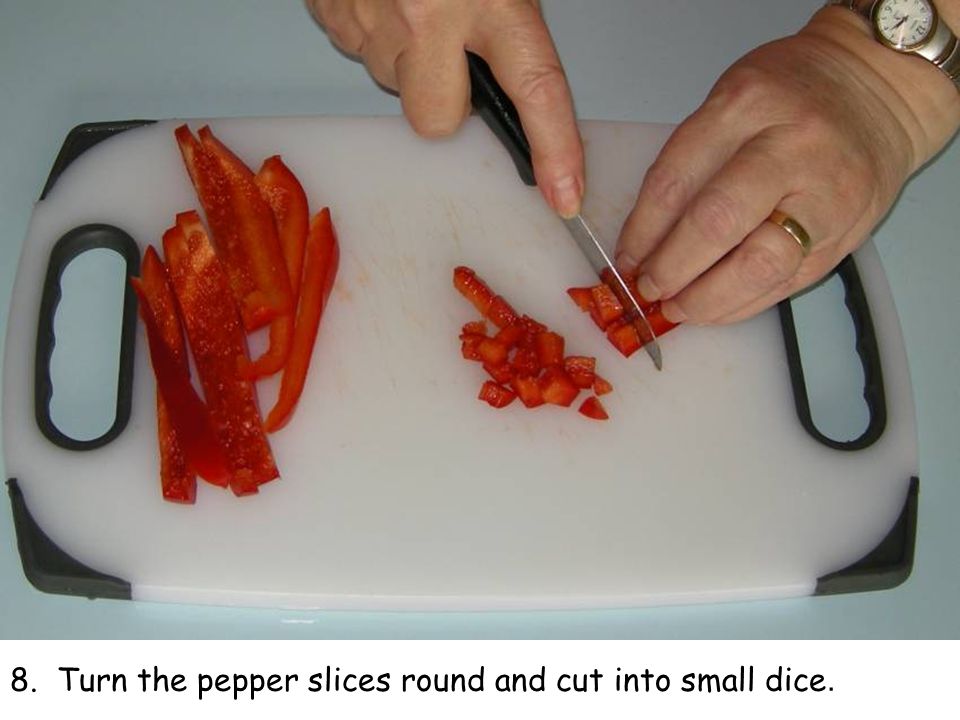 8. Turn the pepper slices round and cut into small dice.