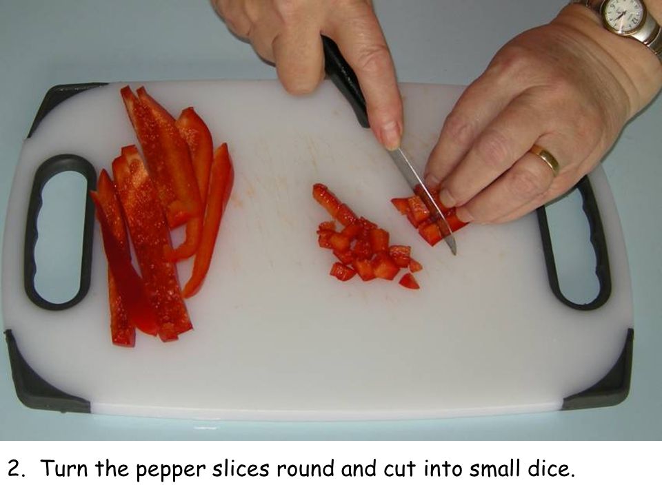 2. Turn the pepper slices round and cut into small dice.